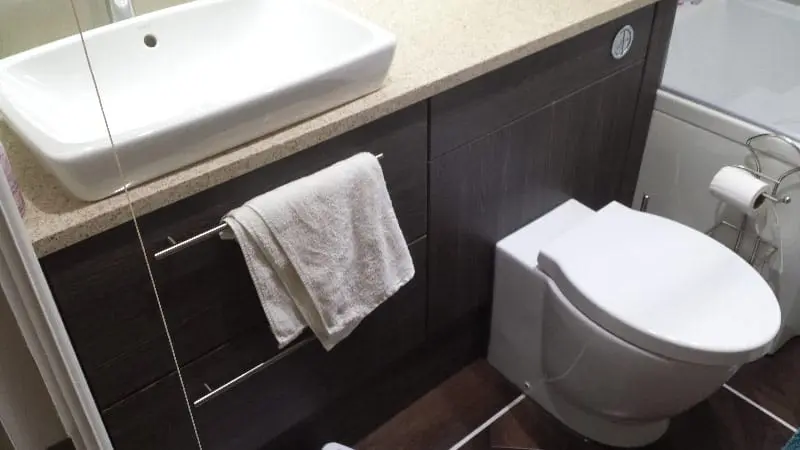 Modern bathroom vanity and wall-mounted toilet