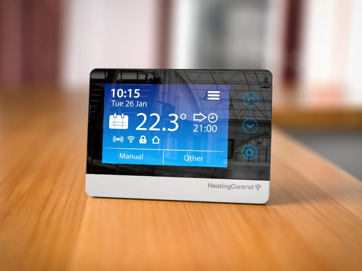 Digital heating thermostat showing a room temperature of 22.3°C
